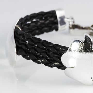 Flowers in black woven leather bracelet